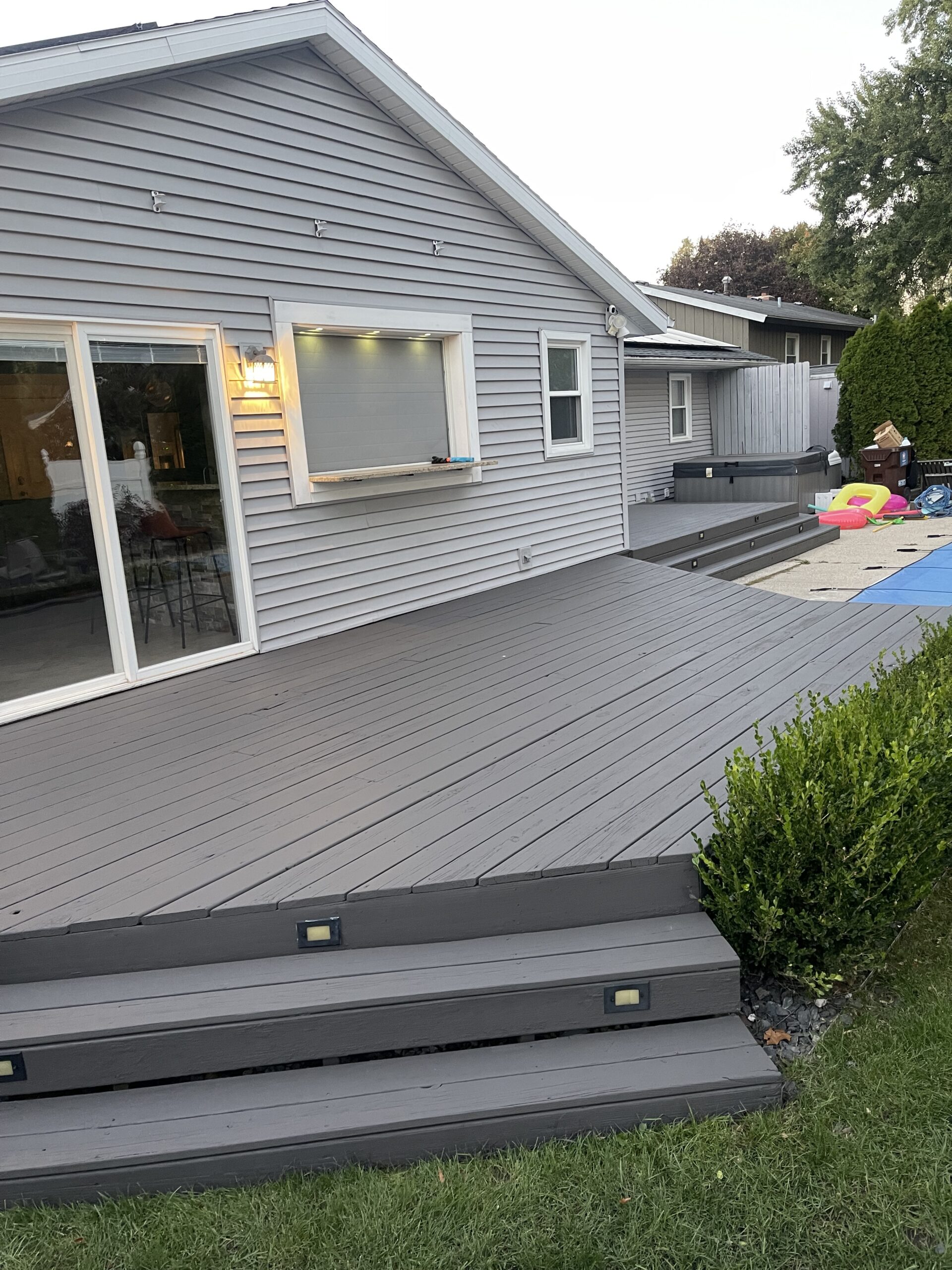 Professional exterior house painting project in Grand Rapids, MI, showcasing a beautifully updated home.