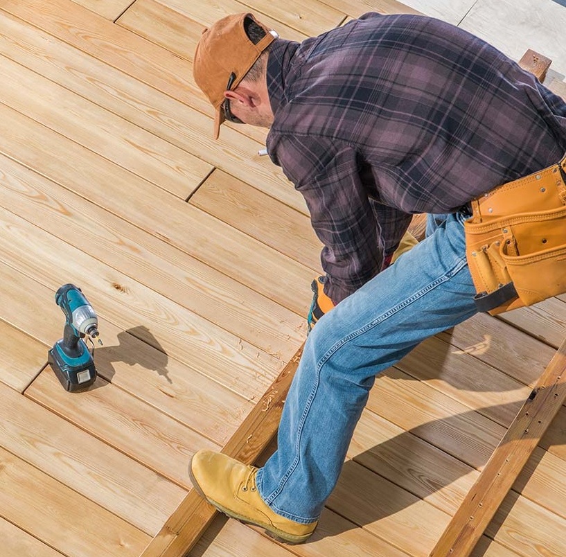 an experienced seattle deck builder preparing partitions for a new deck